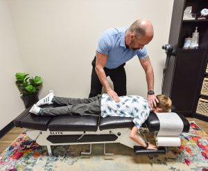 Dr Dan Findlay With Patient | Chiropractical | SW Calgary | Chiropractor